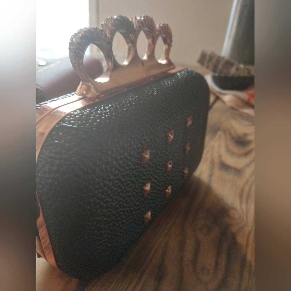 Rhianna brass knuckle clutch